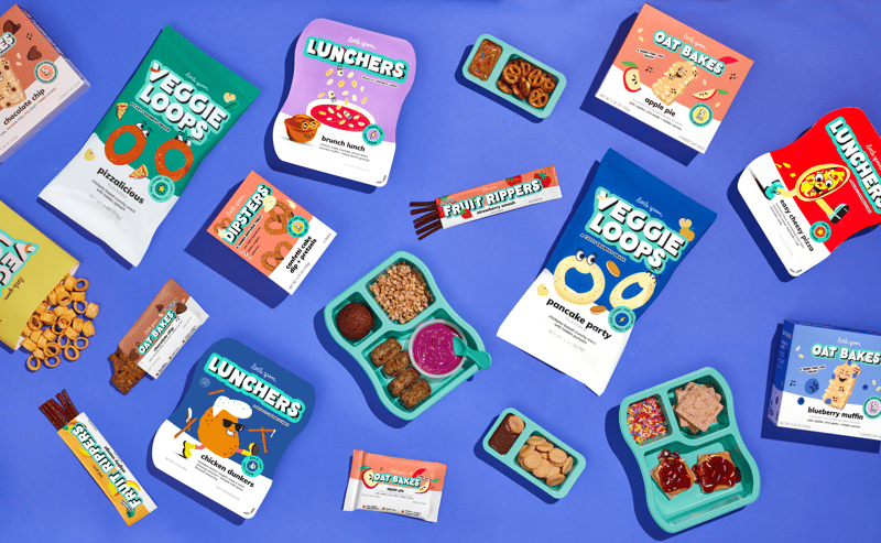 Little Spoon - products in and out of their packaging including fruit rippers, lunchers, oat bakes, and veggie loops.