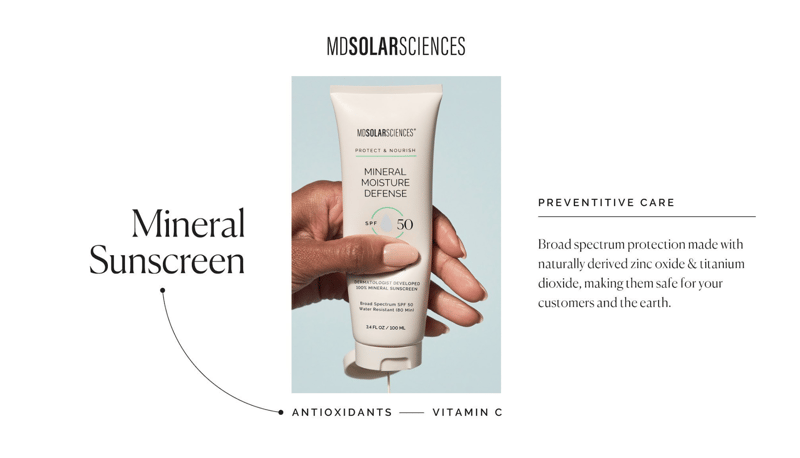 Woman's hand squeezing tube of MD Solar Sciences Mineral Sunscreen with antioxidants and vitamin C for preventative care.