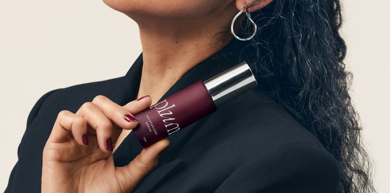 model holding Plum moisturizing serum